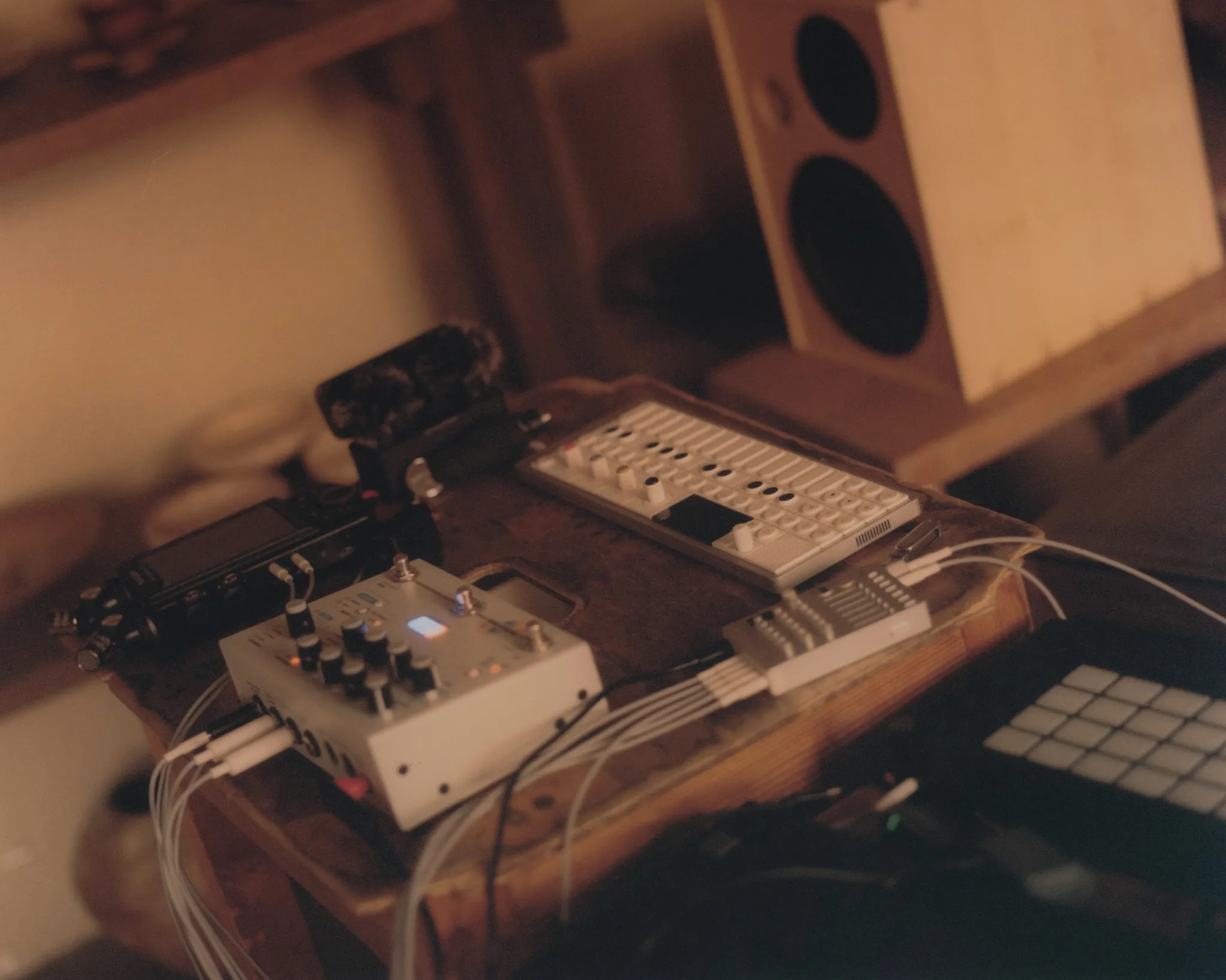Huh Namhoon's synthesizers and mixer in warm light