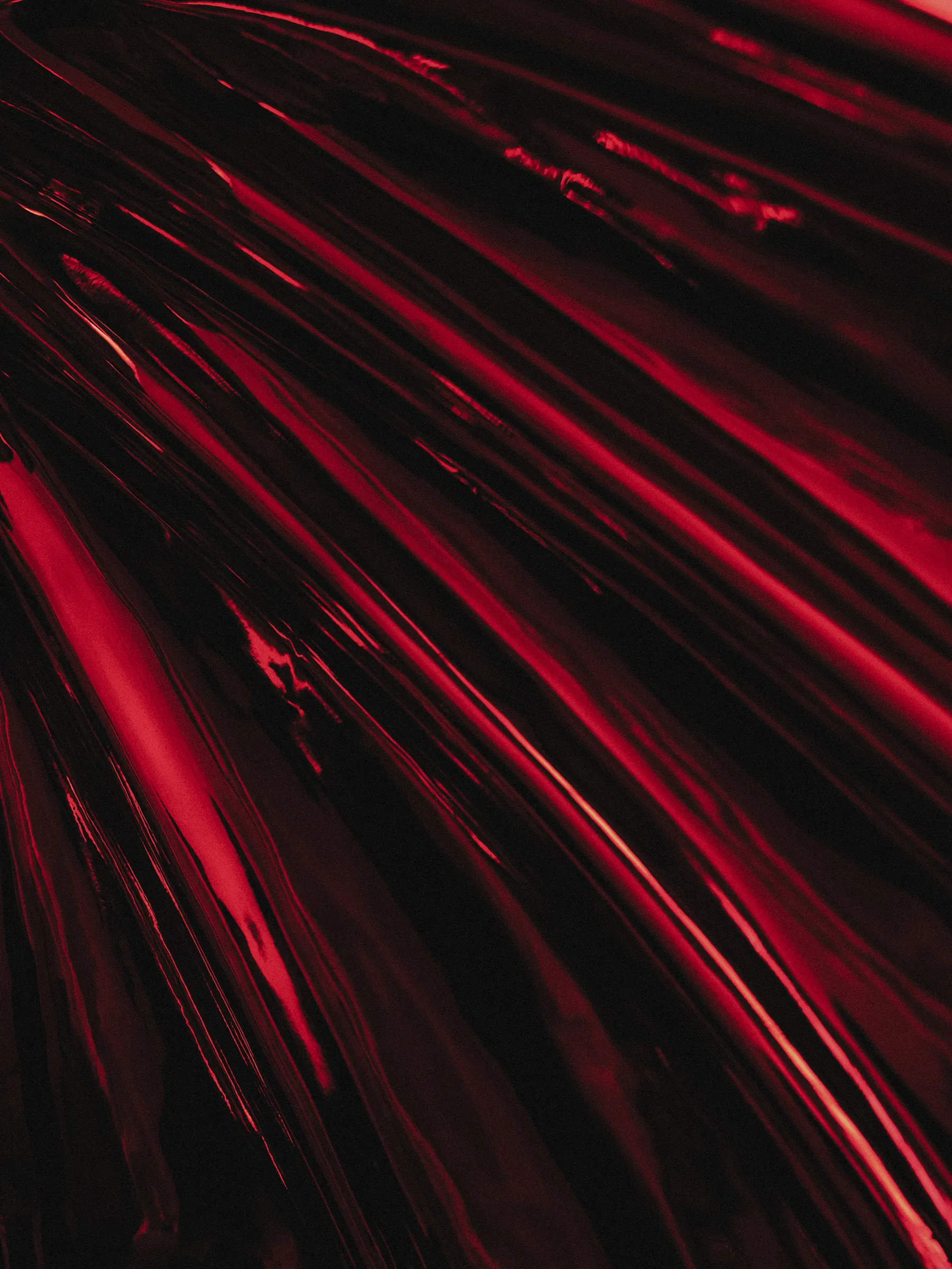 Devilish pop creature in high-gloss red among Tegner’s marble giants