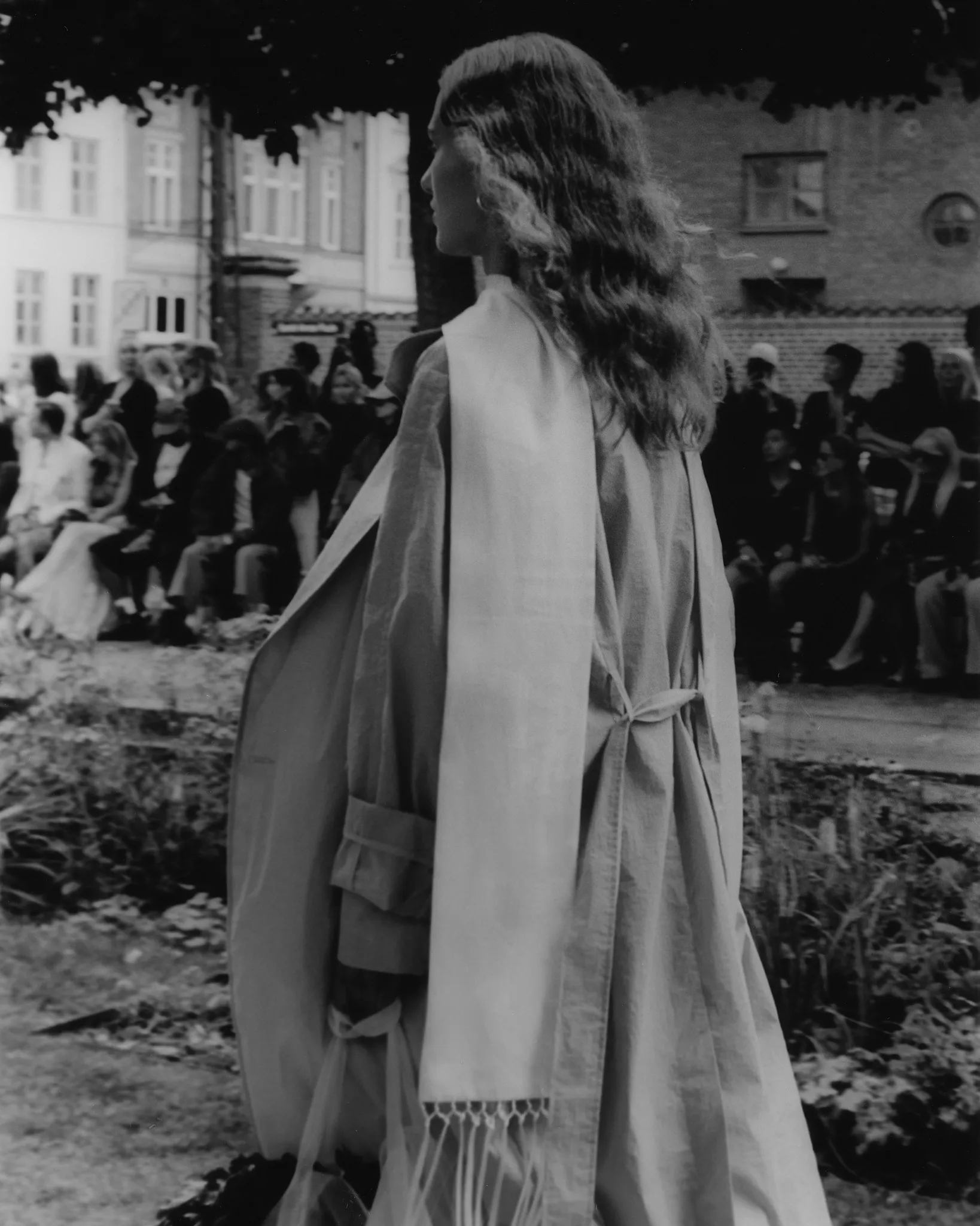 MKDT Studio SS27 at Copenhagen Fashion Week – fringed cape in motion, hand-printed film photograph