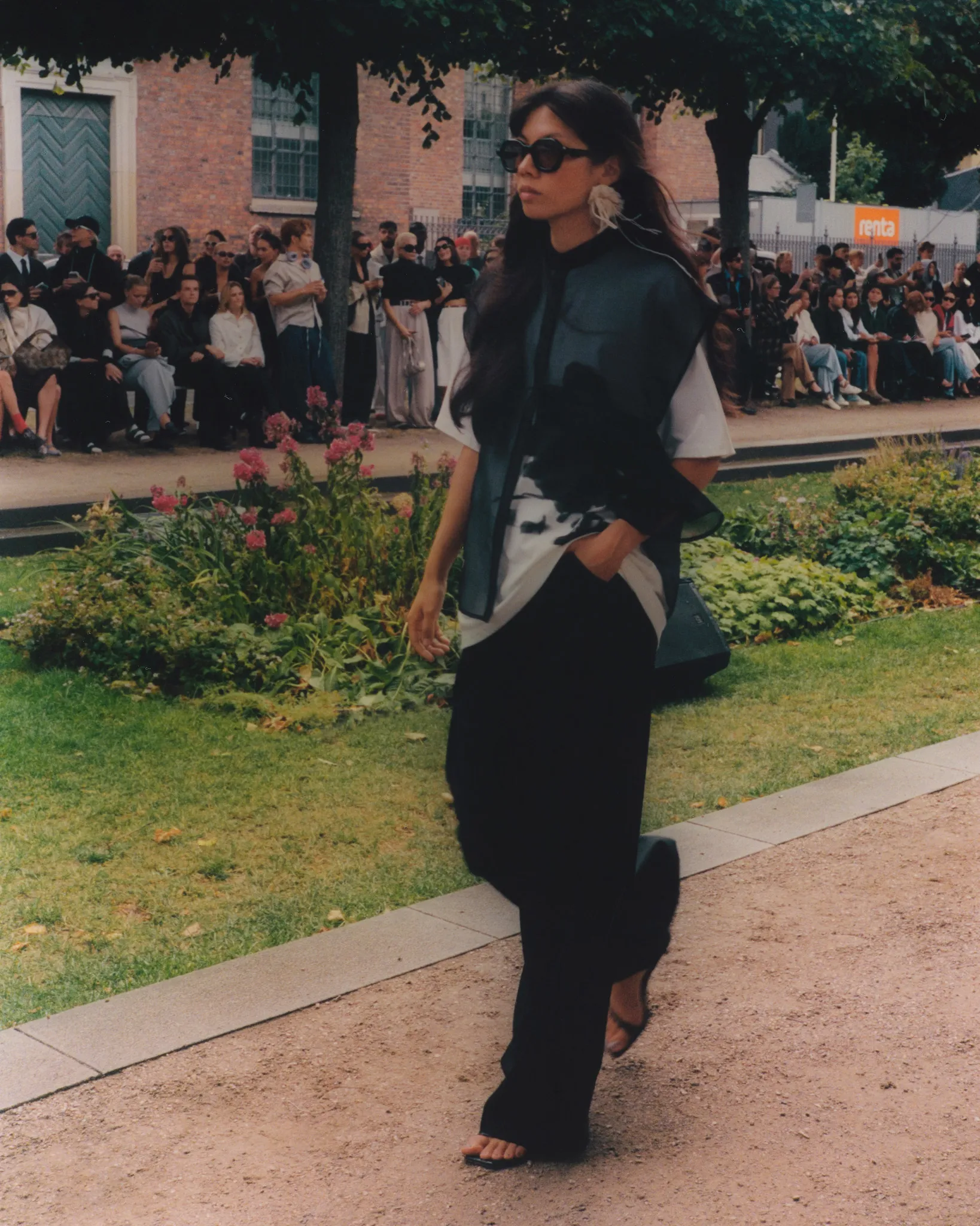 MKDT Studio SS27 runway looks – relaxed dark suiting and white tailoring