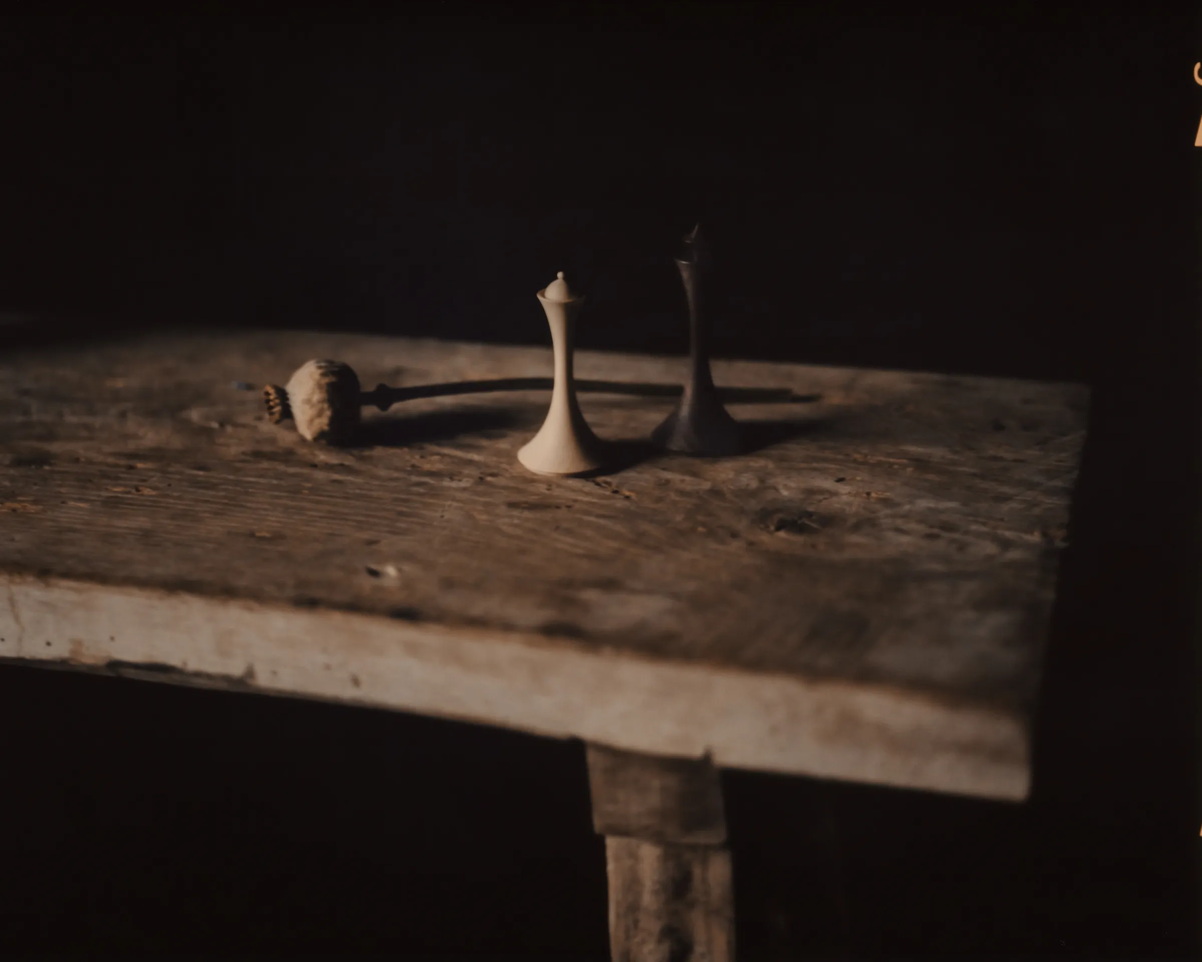 Turned wooden chess pieces on film in warm directional light, Hasselblad 500CM square medium format negative