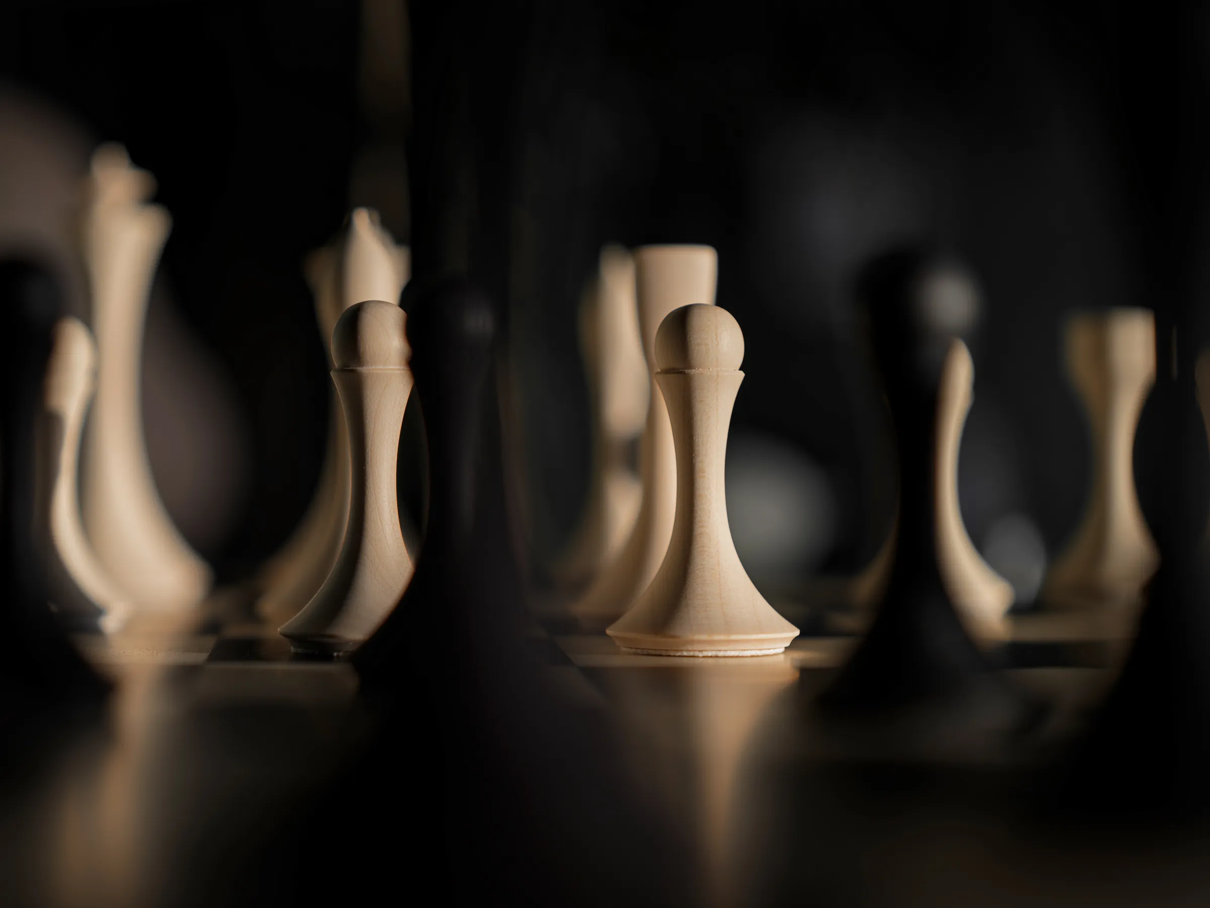 Cream white chess pieces built out of gradient light on matte oiled wood, Hasselblad X2D II 100C