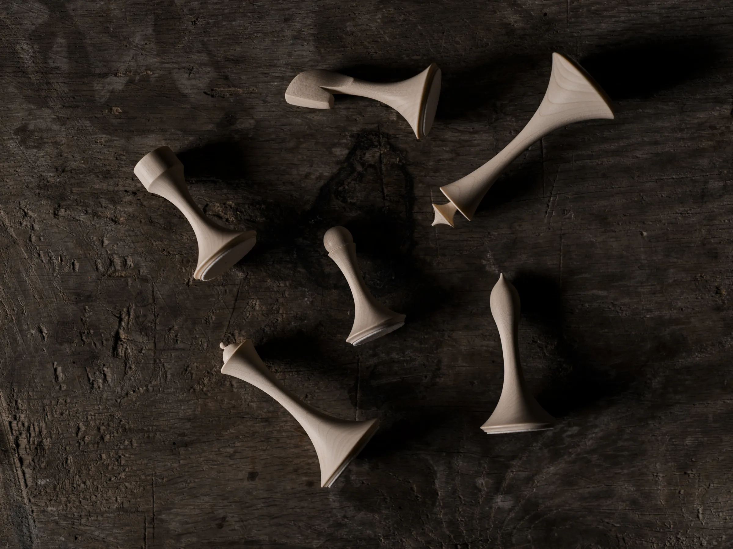 Turned wooden knights resting in a bowl, Hasselblad X2D II 100C