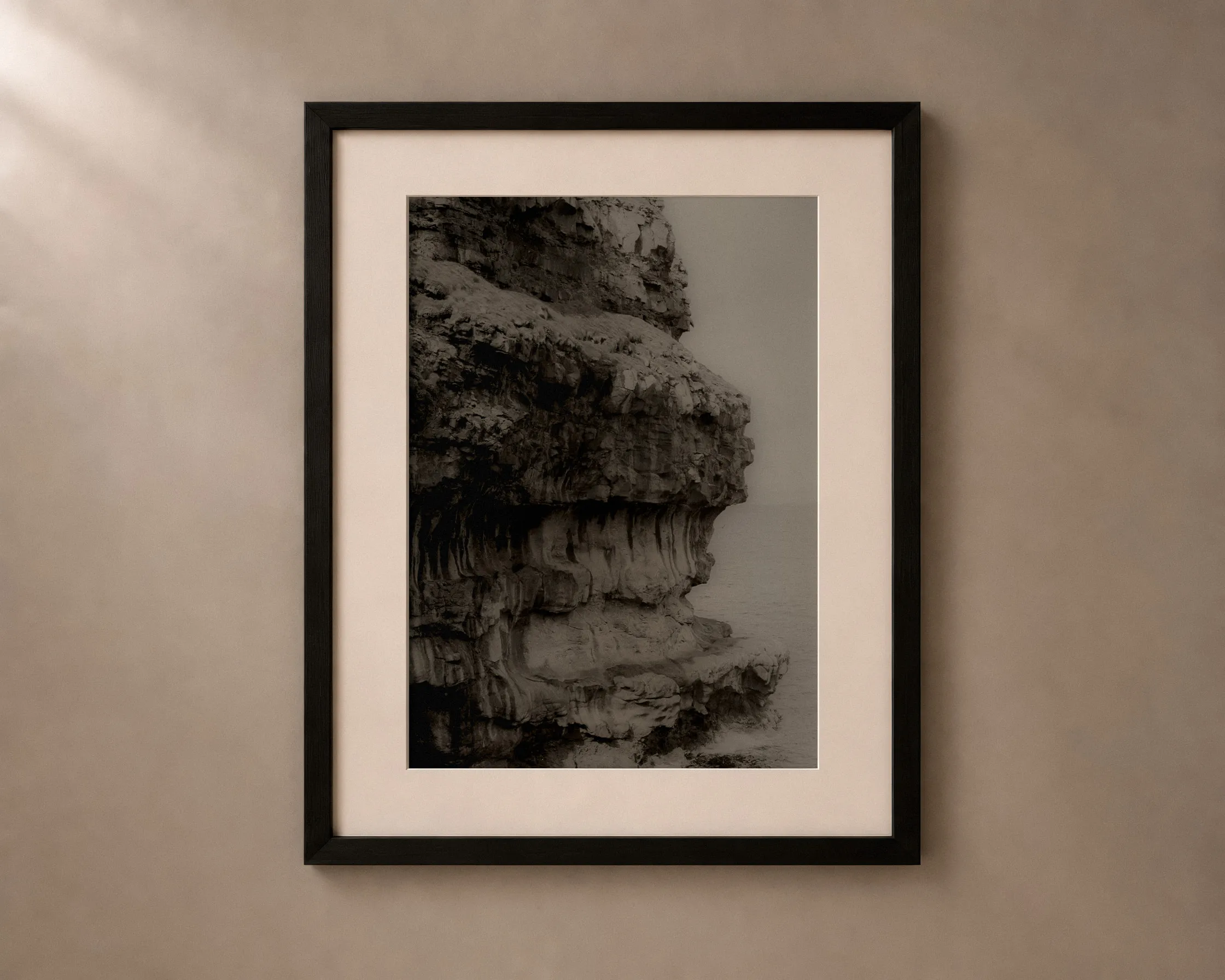 Gorge, framed: Layered sea cliff in overcast light