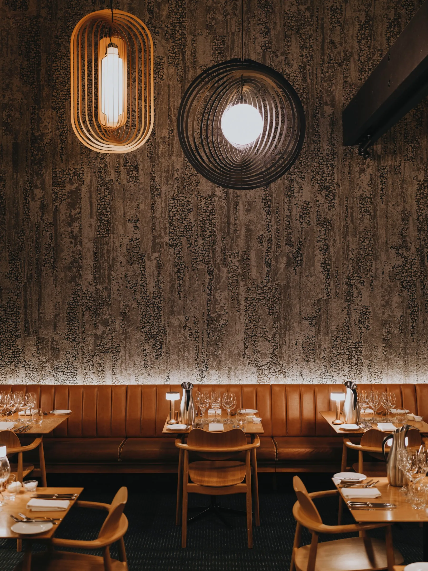 The restaurant at Hotel Føroyar, woven pendant lamps over the tables